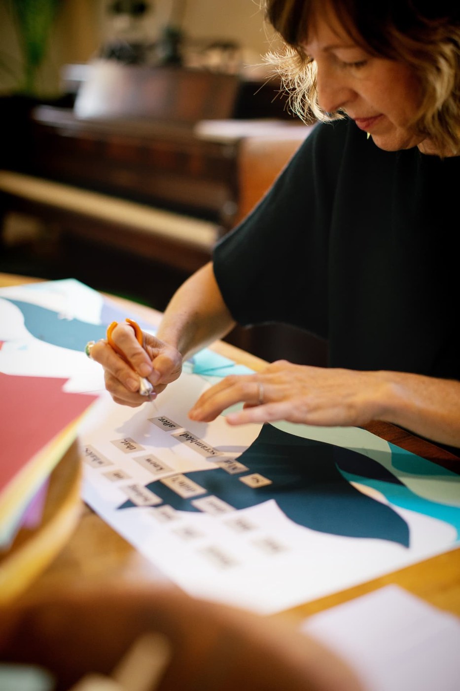 Susanna B. Klingenberg at work cutting paper in her studio